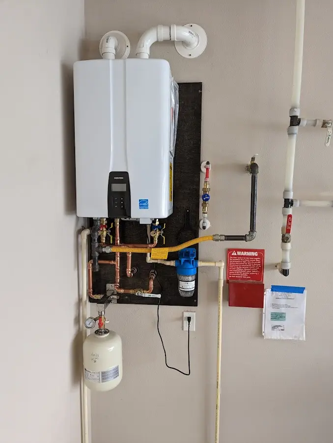 Professional plumber installing copper piping in a Palm Bay home